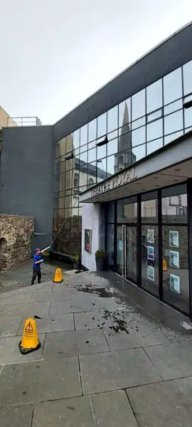 Cleaning the glazing of a city-centre commercial building