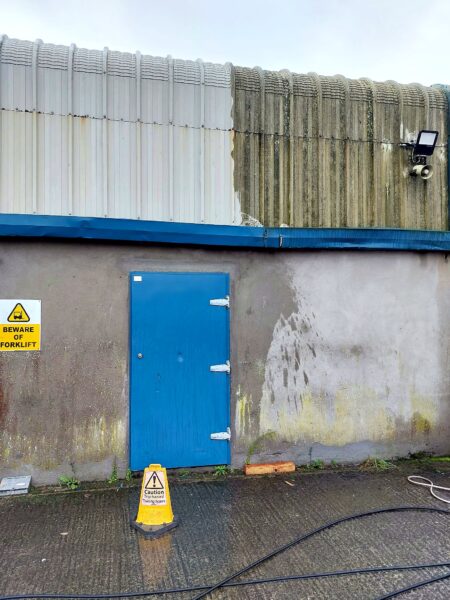 Industrial unit cladding and wall partly cleaned, showing the difference