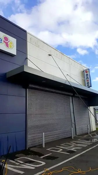 Cleaning above the shutters of a commercial unit